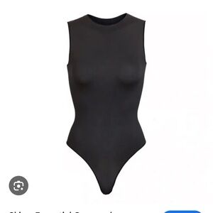 SKIMS ESSENTIAL CREW NECK SLEEVELESS BODYSUIT in CHARCOAL GUNMETAL / ONYX